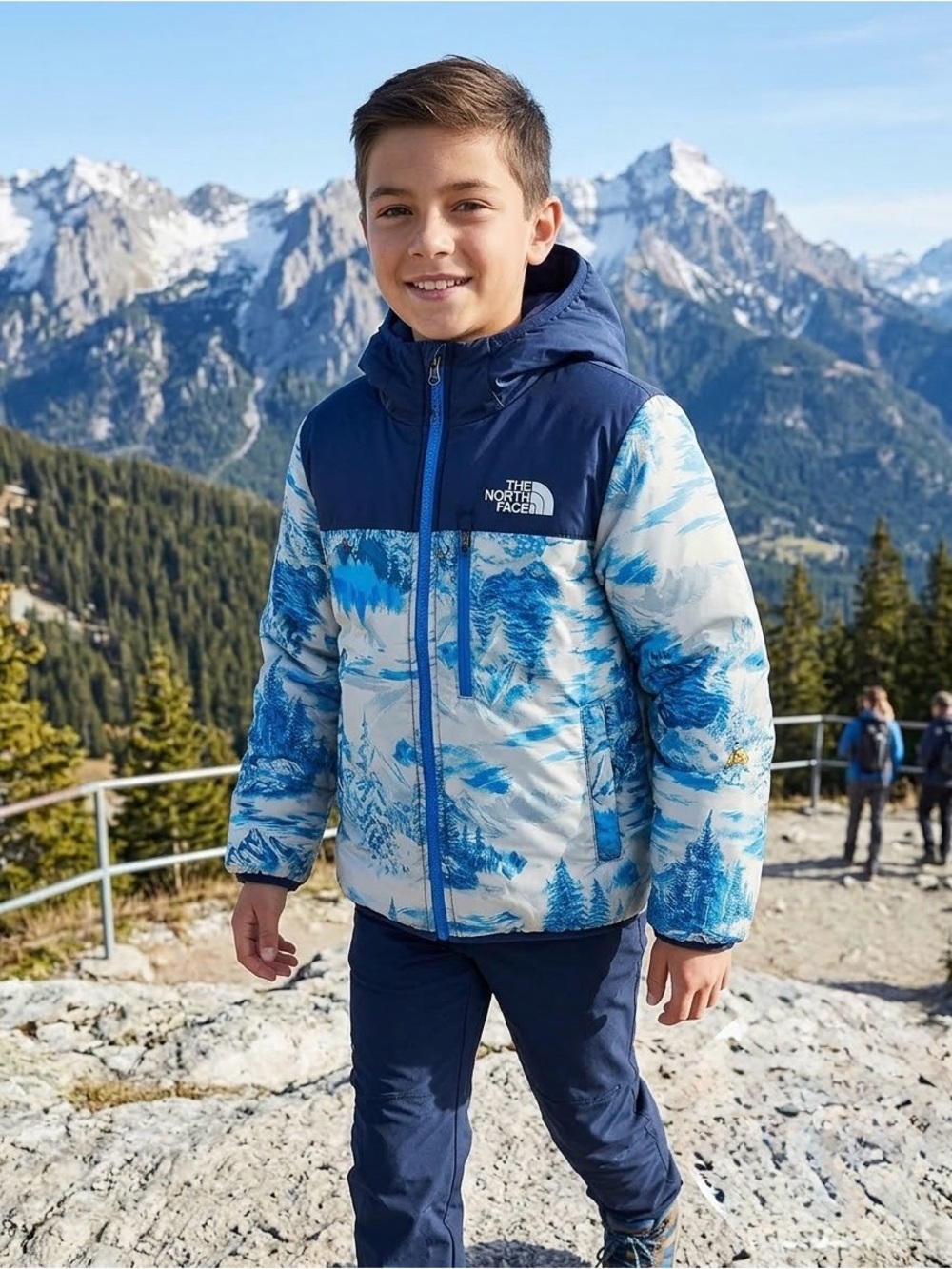 The North Face Boys' Reversible Perrito Jacket in a blue mountain scenic print
